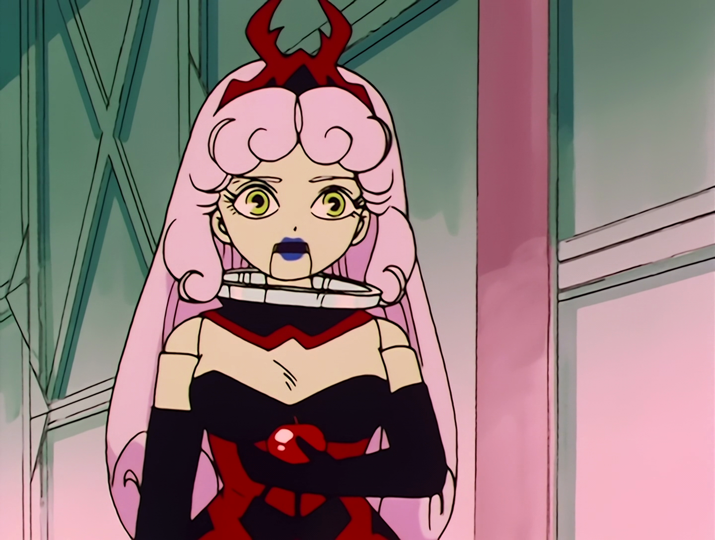 Murid, a Youma from Sailor Moon episode 11. She resembles a mechanical doll with slightly greenish skin, and she’s a bit chubby. She has long pink hair with a red and black tiara, and wears a red and black dress with a ruff collar. She’s holding an apple which she uses for evil purposes.